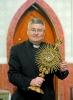 Father Michael Burzynski holds a relic from the veil of Mary, which came from the Chartres Cathedral in Chartres, France around 1970, the time of the French Revolution. This relic was presented to Bishop John Timon in the 1850s. (Dan Cappellazzo/Staff Pho